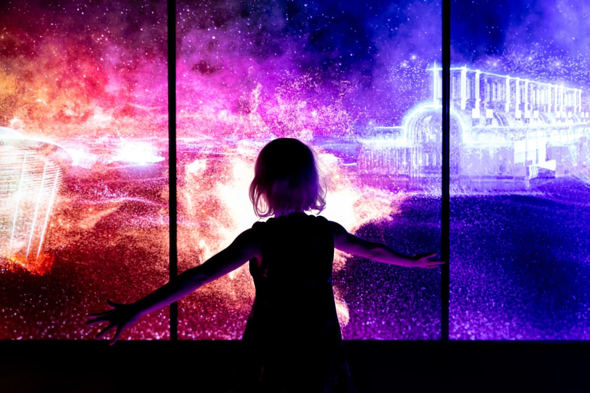Image of a girl in front of a space exhibition